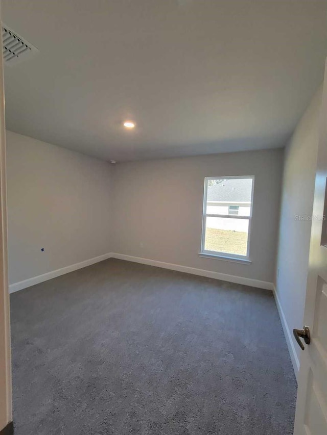 12384 SW 96th Ln, Dunnellon, FL 34432 - empty room featuring dark colored carpet and recessed lighting