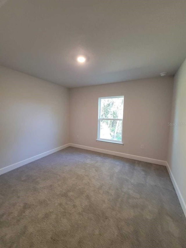 12384 SW 96th Ln, Dunnellon, FL 34432 - spare room with dark colored carpet, recessed lighting, and a smoke detector