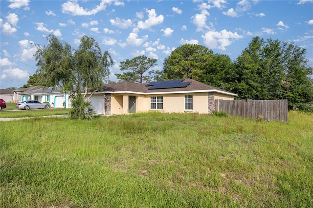 51 Pine Trace Loop, Ocala, FL 34472 - ranch-style home featuring stucco siding and solar panels