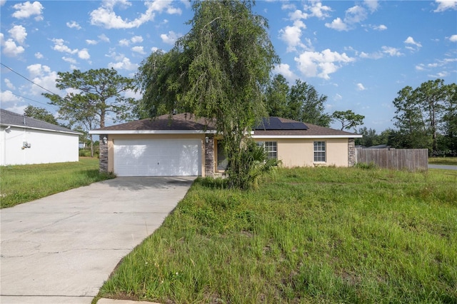 51 Pine Trace Loop, Ocala, FL 34472 - ranch-style home with roof mounted solar panels, driveway, a garage, and stucco siding