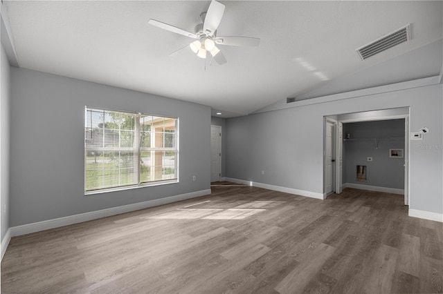 51 Pine Trace Loop, Ocala, FL 34472 - unfurnished room featuring vaulted ceiling, a ceiling fan, and wood finished floors