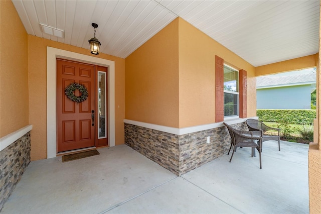 9236 SW 91st Court Rd, Ocala, FL 34481 - entrance to property with covered porch, stucco siding, and stone siding
