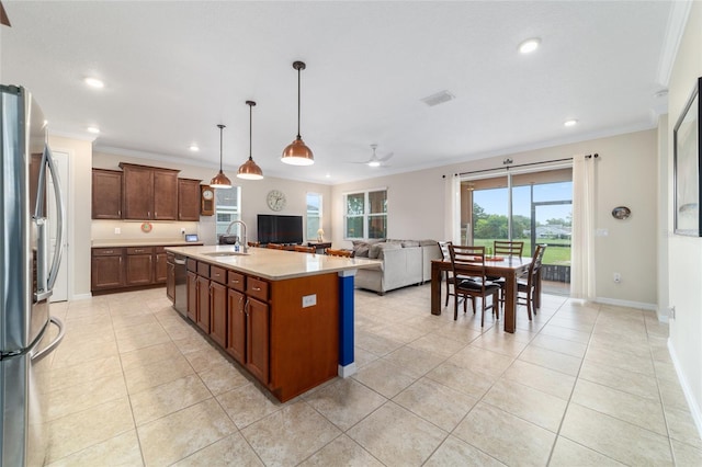 9236 SW 91st Court Rd, Ocala, FL 34481 - kitchen with ornamental molding, appliances with stainless steel finishes, light tile patterned flooring, recessed lighting, and light countertops