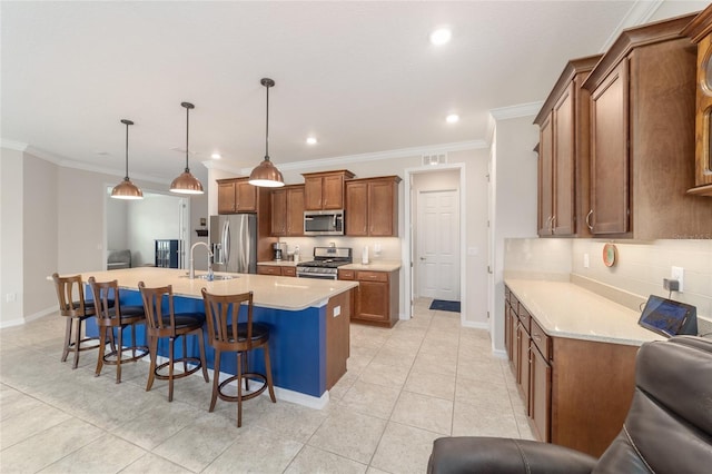 9236 SW 91st Court Rd, Ocala, FL 34481 - kitchen featuring stainless steel appliances, brown cabinetry, a breakfast bar area, recessed lighting, and a kitchen island with sink