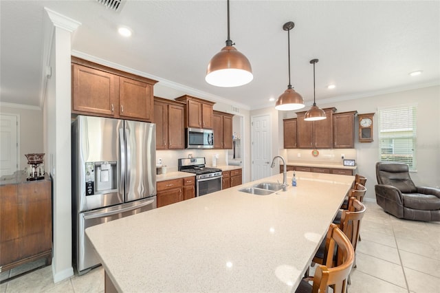 9236 SW 91st Court Rd, Ocala, FL 34481 - kitchen with appliances with stainless steel finishes, a breakfast bar, light tile patterned floors, a large island with sink, and brown cabinetry