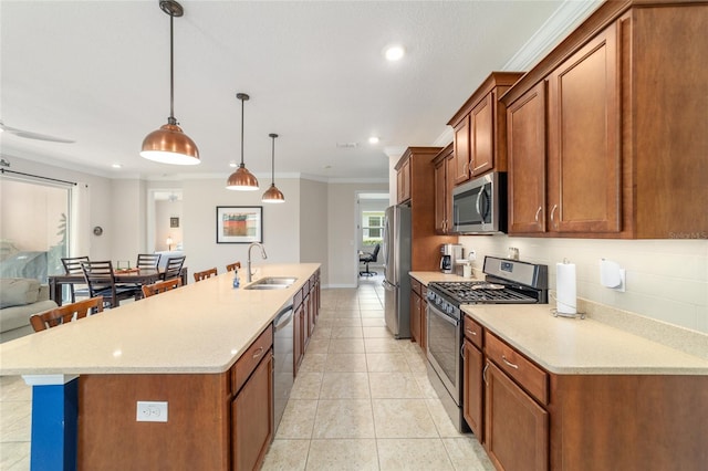 9236 SW 91st Court Rd, Ocala, FL 34481 - kitchen with appliances with stainless steel finishes, a center island with sink, crown molding, recessed lighting, and light tile patterned flooring