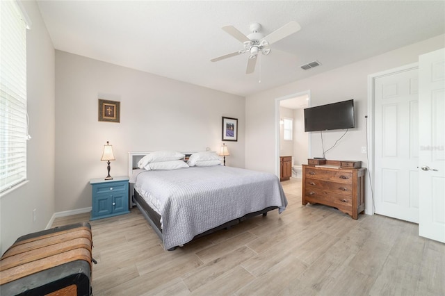 9236 SW 91st Court Rd, Ocala, FL 34481 - bedroom with light wood-type flooring, ensuite bath, and ceiling fan