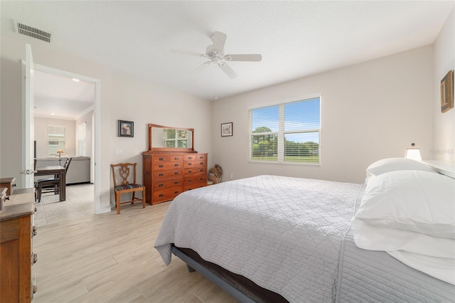 9236 SW 91st Court Rd, Ocala, FL 34481 - bedroom with ceiling fan and light wood-style floors