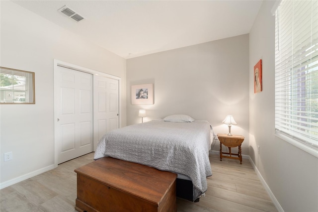 9236 SW 91st Court Rd, Ocala, FL 34481 - bedroom with light wood-style floors and a closet