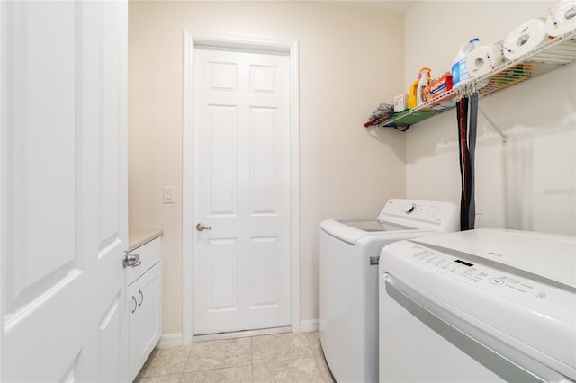 9236 SW 91st Court Rd, Ocala, FL 34481 - laundry room featuring separate washer and dryer, cabinet space, and light tile patterned flooring