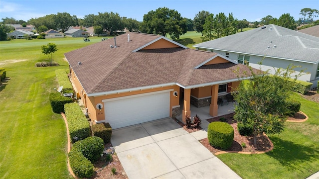 9236 SW 91st Court Rd, Ocala, FL 34481 - view of front of home featuring an attached garage, a front yard, a porch, stone siding, and driveway