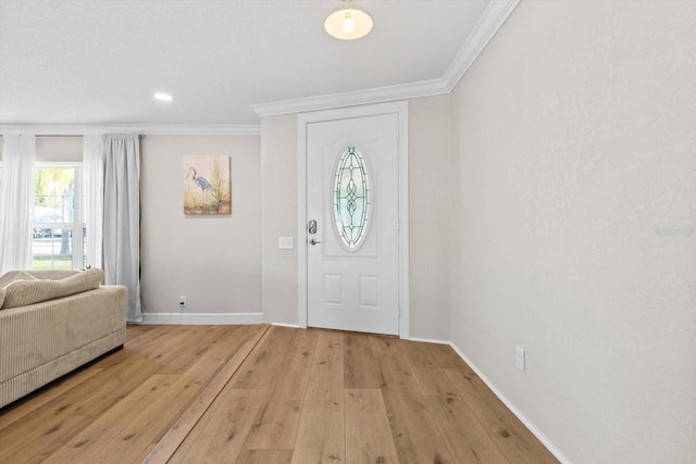 1860 NW 16th St, Crystal River, FL 34428 - foyer entrance with crown molding, light wood-style floors, and recessed lighting