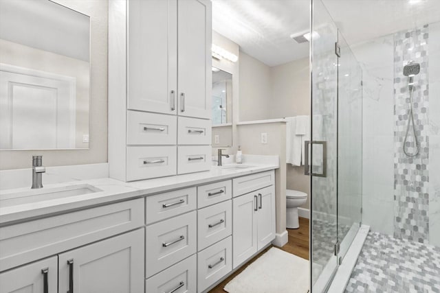 1860 NW 16th St, Crystal River, FL 34428 - full bath featuring a stall shower, double vanity, and wood finished floors