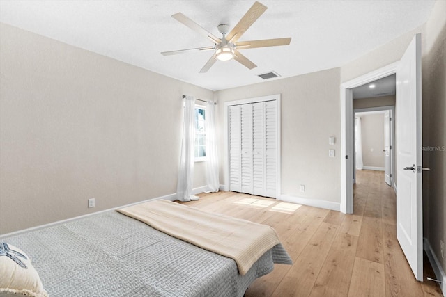 1860 NW 16th St, Crystal River, FL 34428 - bedroom with light wood-style flooring, a closet, and a ceiling fan