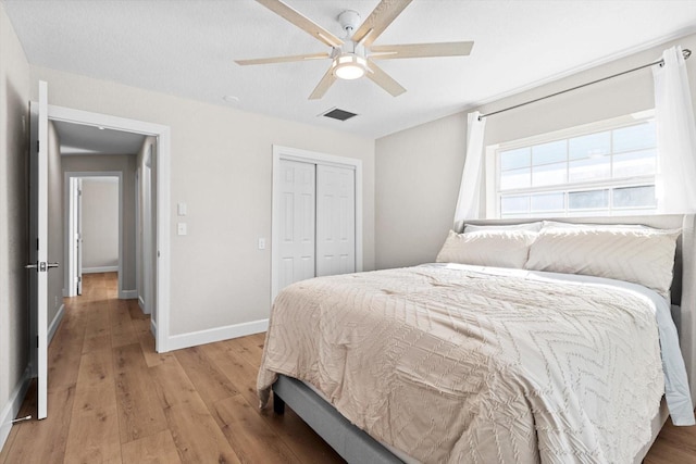 1860 NW 16th St, Crystal River, FL 34428 - bedroom with light wood-style floors, a closet, and ceiling fan