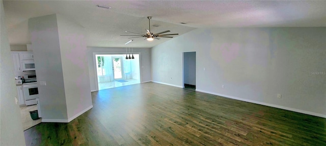 8771 SW 115th St, Ocala, FL 34481 - unfurnished living room featuring lofted ceiling, dark wood-type flooring, and ceiling fan