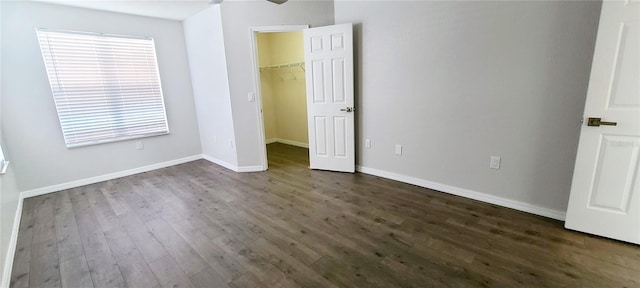 8771 SW 115th St, Ocala, FL 34481 - unfurnished bedroom featuring dark wood finished floors and a spacious closet