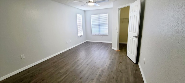 8771 SW 115th St, Ocala, FL 34481 - unfurnished bedroom featuring dark wood-type flooring, a ceiling fan, and a textured wall