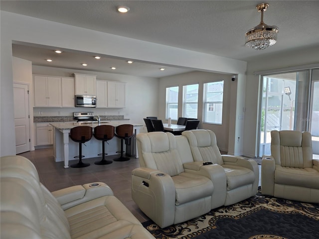 5962 SW 80th Ln, Ocala, FL 34476 - living room with recessed lighting and dark tile patterned floors