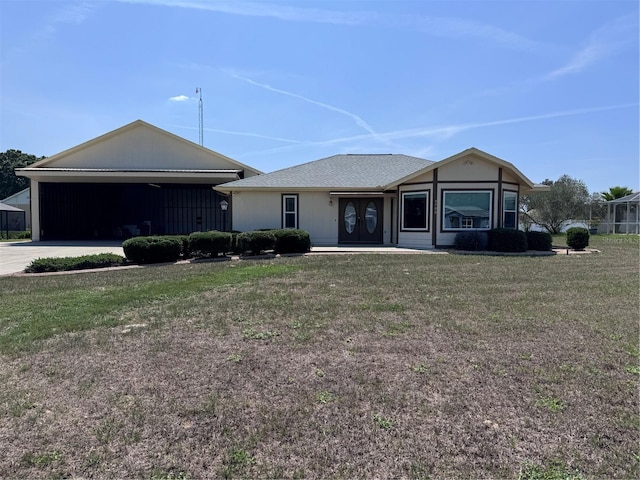 9700 SE 72nd Ave, Ocala, FL 34472 - view of front facade featuring driveway, an attached garage, and a front lawn