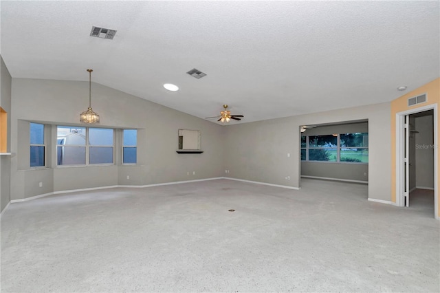9069 SW 91st Cir, Ocala, FL 34481 - carpeted spare room with a ceiling fan, lofted ceiling, a textured ceiling, and healthy amount of natural light