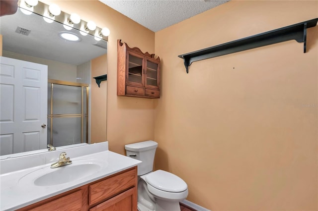 9069 SW 91st Cir, Ocala, FL 34481 - full bathroom with a shower with shower door, vanity, and a textured ceiling