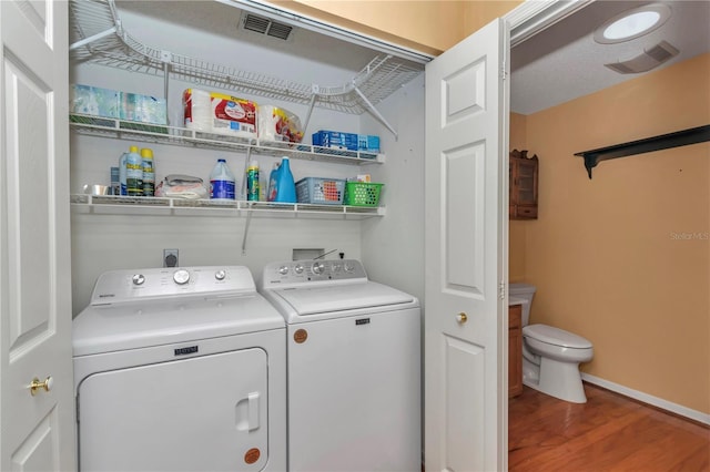 9069 SW 91st Cir, Ocala, FL 34481 - washroom featuring independent washer and dryer and wood finished floors