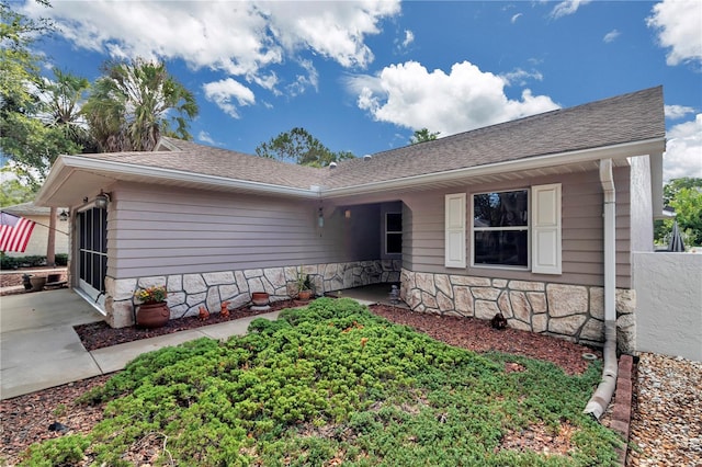 9069 SW 91st Cir, Ocala, FL 34481 - single story home featuring stone siding and roof with shingles