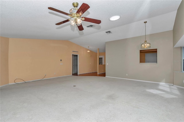 9069 SW 91st Cir, Ocala, FL 34481 - unfurnished living room with vaulted ceiling, ceiling fan, carpet floors, and a textured ceiling