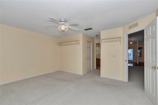 9069 SW 91st Cir, Ocala, FL 34481 - unfurnished bedroom with a textured ceiling, light carpet, and ceiling fan