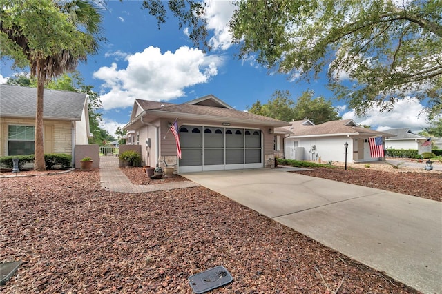 9069 SW 91st Cir, Ocala, FL 34481 - single story home with a gate, driveway, a garage, and stone siding
