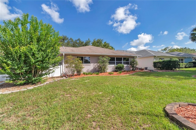 9069 SW 91st Cir, Ocala, FL 34481 - ranch-style home featuring a front yard and stucco siding