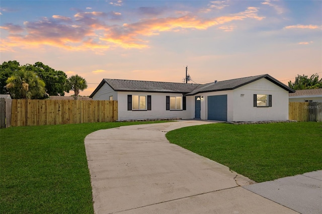 2817 Rheims Ave, Melbourne, FL 32935 - view of front facade with a garage, driveway, stucco siding, and a shingled roof