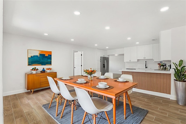 2817 Rheims Ave, Melbourne, FL 32935 - dining area featuring wood finish floors and recessed lighting