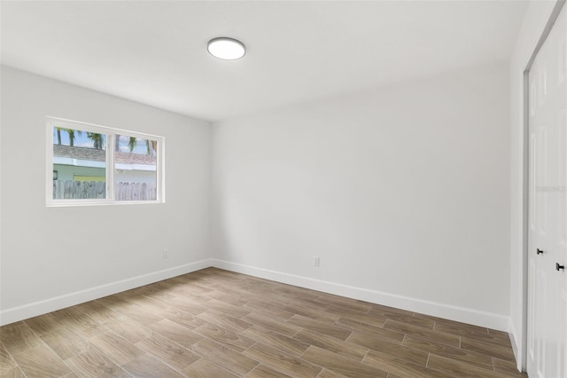 2817 Rheims Ave, Melbourne, FL 32935 - spare room featuring baseboards and wood finished floors