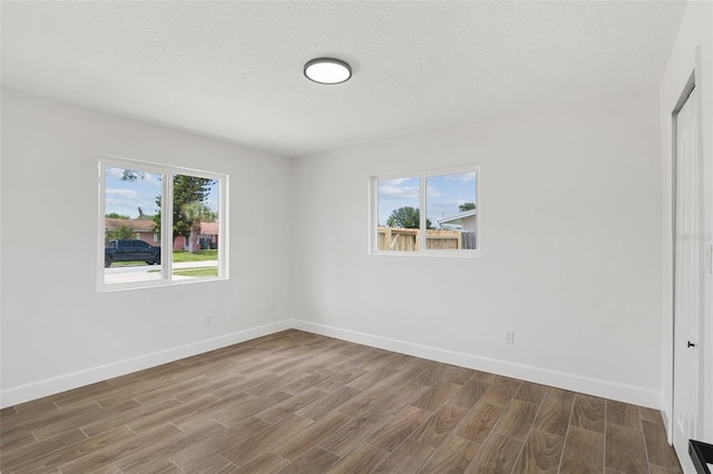 2817 Rheims Ave, Melbourne, FL 32935 - unfurnished bedroom featuring wood finished floors and a textured ceiling