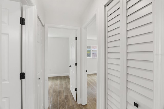2817 Rheims Ave, Melbourne, FL 32935 - hall featuring dark wood finished floors and baseboards