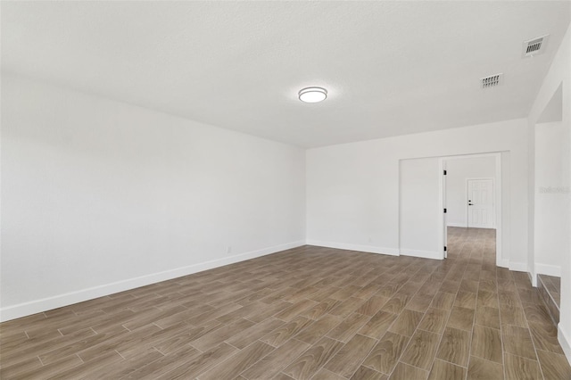 2817 Rheims Ave, Melbourne, FL 32935 - empty room featuring wood finished floors and baseboards