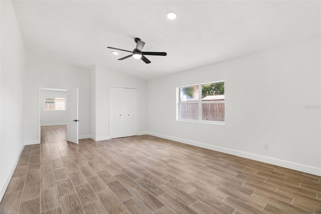2817 Rheims Ave, Melbourne, FL 32935 - unfurnished bedroom with light wood-style flooring, a closet, ceiling fan, and recessed lighting