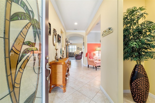 7814 SW 97th Cir, Ocala, FL 34481 - hallway with crown molding, arched walkways, and light tile patterned flooring