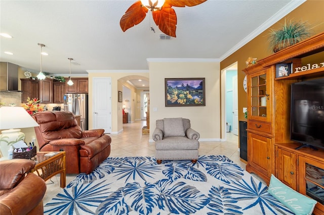 7814 SW 97th Cir, Ocala, FL 34481 - living room with arched walkways, light tile patterned floors, ornamental molding, ceiling fan, and recessed lighting