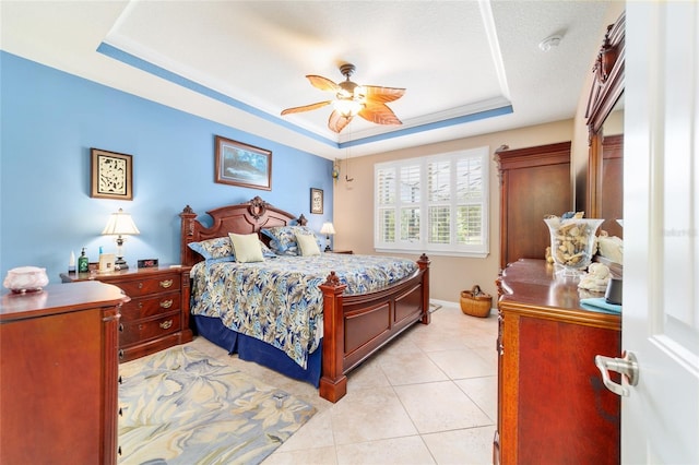 7814 SW 97th Cir, Ocala, FL 34481 - bedroom with a raised ceiling, light tile patterned floors, and a ceiling fan