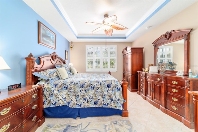 7814 SW 97th Cir, Ocala, FL 34481 - bedroom with a tray ceiling, light tile patterned floors, and ceiling fan