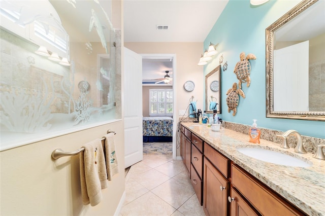 7814 SW 97th Cir, Ocala, FL 34481 - bathroom with double vanity, a ceiling fan, tile patterned flooring, ensuite bath, and a shower