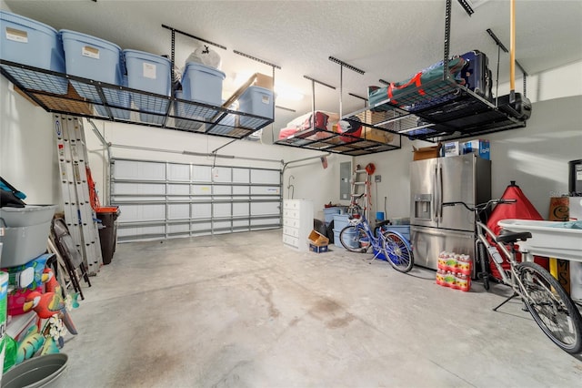 7814 SW 97th Cir, Ocala, FL 34481 - garage featuring stainless steel refrigerator with ice dispenser and electric panel