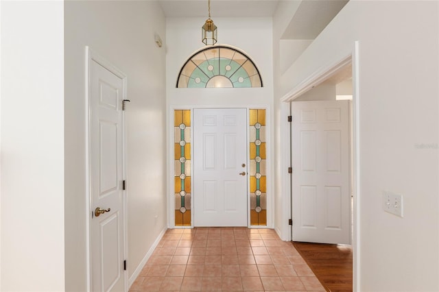 9180 SW 202nd Avenue Rd, Dunnellon, FL 34431 - foyer with baseboards and light tile patterned floors