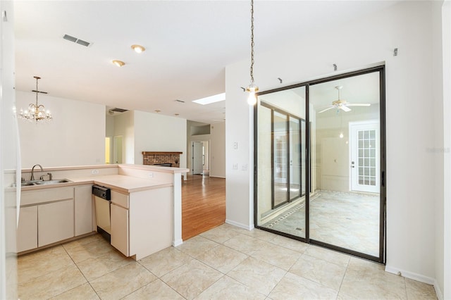 9180 SW 202nd Avenue Rd, Dunnellon, FL 34431 - kitchen with open floor plan, dishwashing machine, decorative light fixtures, light tile patterned floors, and ceiling fan
