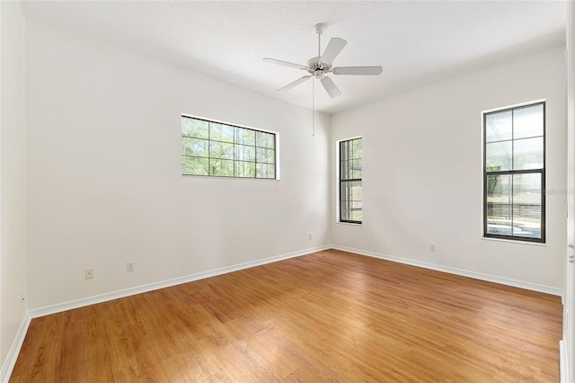 9180 SW 202nd Avenue Rd, Dunnellon, FL 34431 - unfurnished room featuring light wood finished floors and ceiling fan