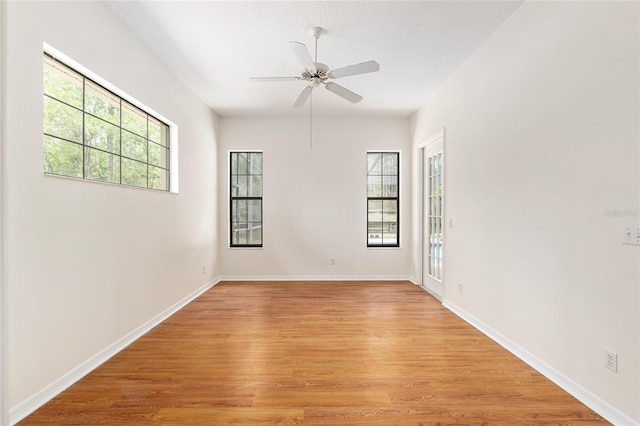 9180 SW 202nd Avenue Rd, Dunnellon, FL 34431 - spare room with a ceiling fan and light wood-style floors