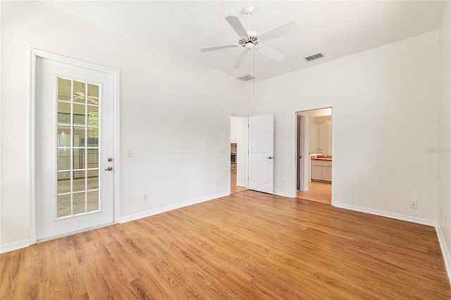 9180 SW 202nd Avenue Rd, Dunnellon, FL 34431 - unfurnished bedroom featuring light wood-style flooring, connected bathroom, and ceiling fan